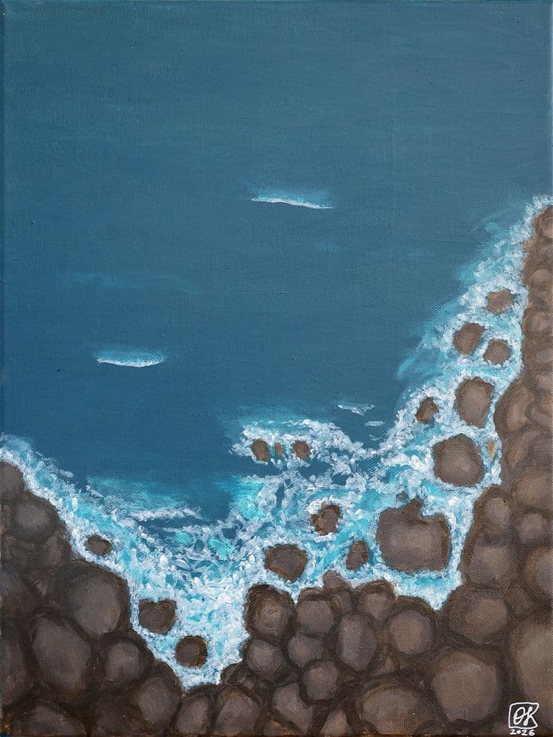 Dark sea waves crashing against the rocky shore